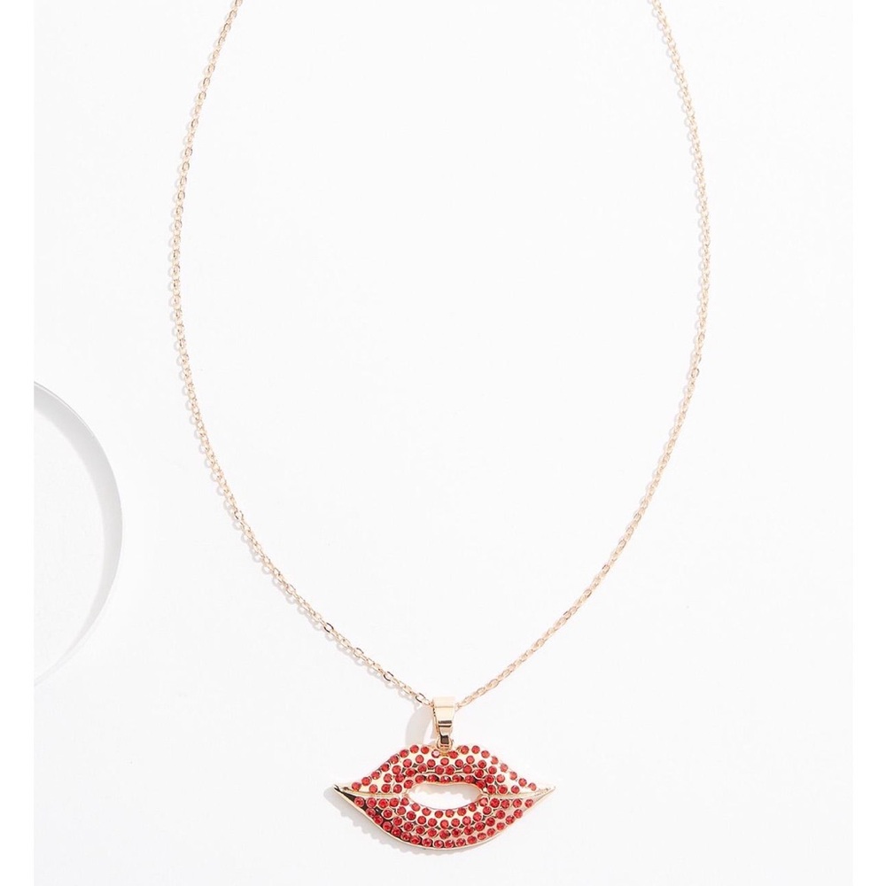 Gold Lip Pendant Necklace with Red Crystal Accent